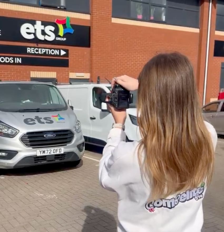 Compelite Pro content creator filming an ETS Group branded van on-site at a scaffolding company depot — behind the scenes scaffolders content